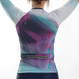 Person wearing a colorful athletic outfit with a marbled pattern on a white background